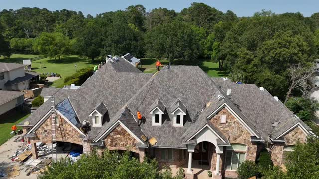 Pulse Roofing crew replacing a residential roof
